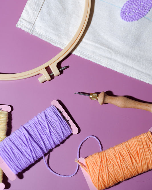 Materials to make a punch needle tote bag